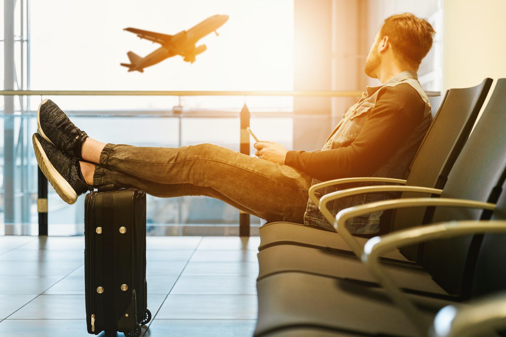 Traveller waiting at an airport gate